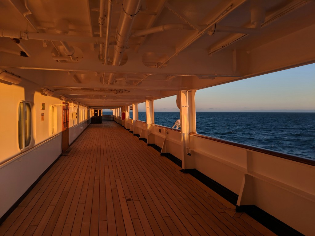 A quiet morning on a cruise ship deck, reflecting on slow travel and retirement planning